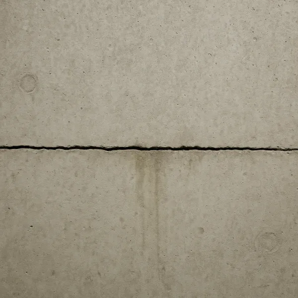 Horizontal crack on a basement foundation wall with water staining